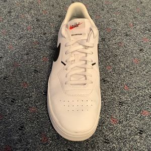 Nike white with black swoosh